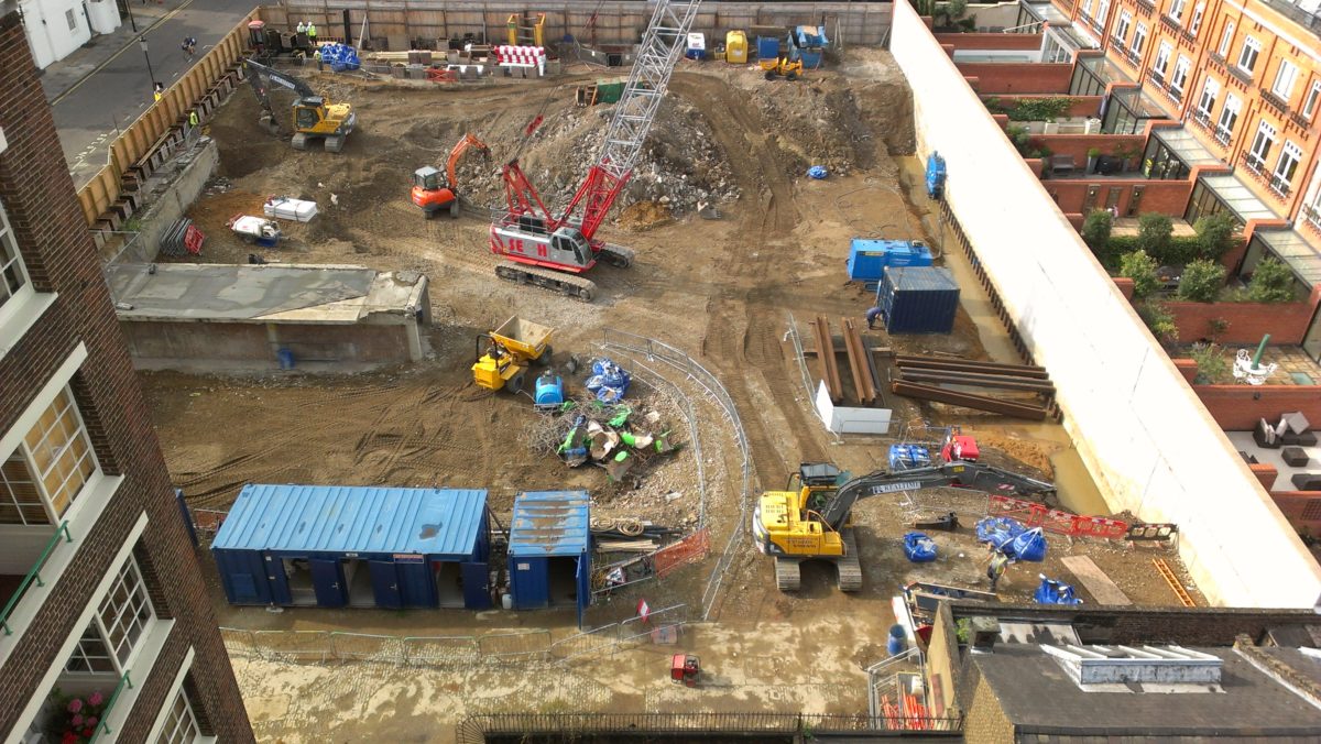 Steel sheet piling machine working on site - Evans Piling UK